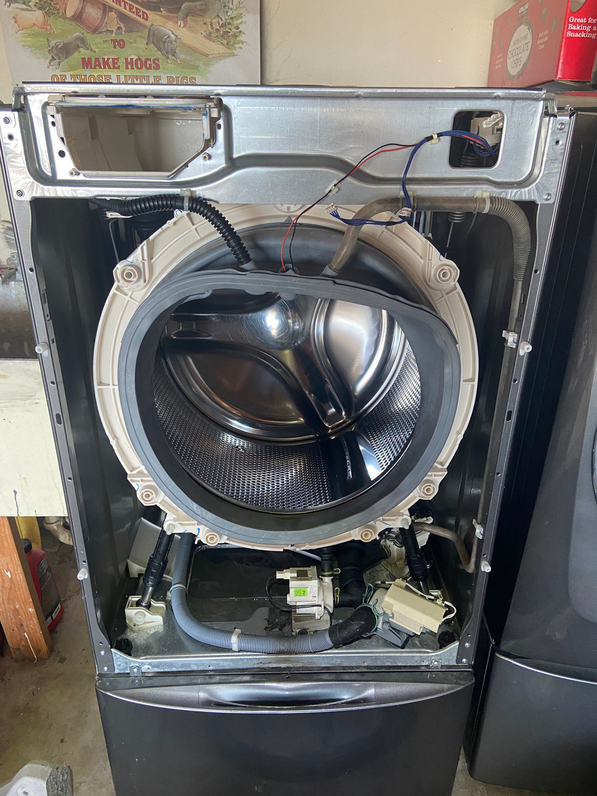 T&B technician diagnosing a washing machine in Southern Oregon