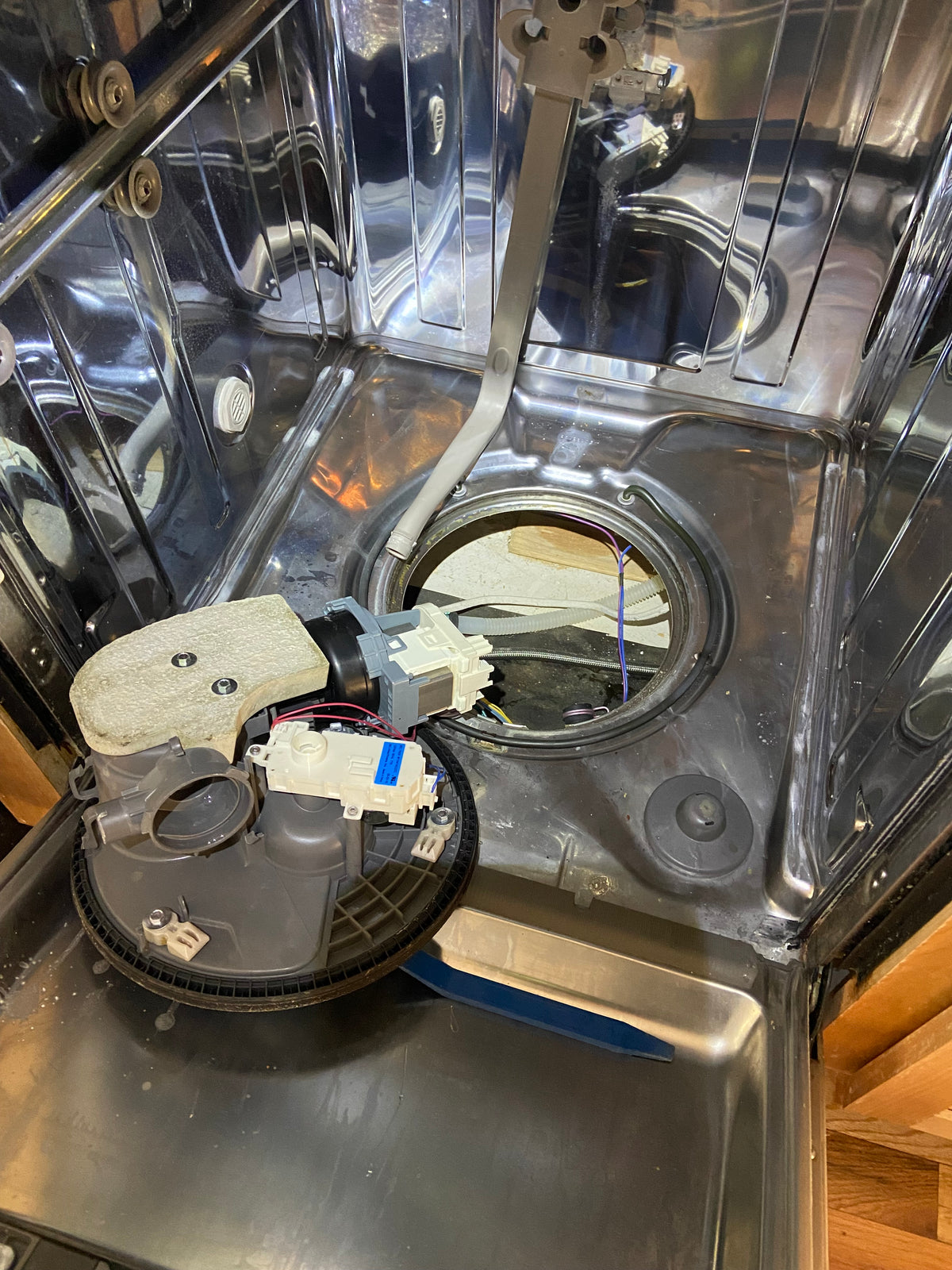 T&B technician diagnosing a dishwasher in Southern Oregon