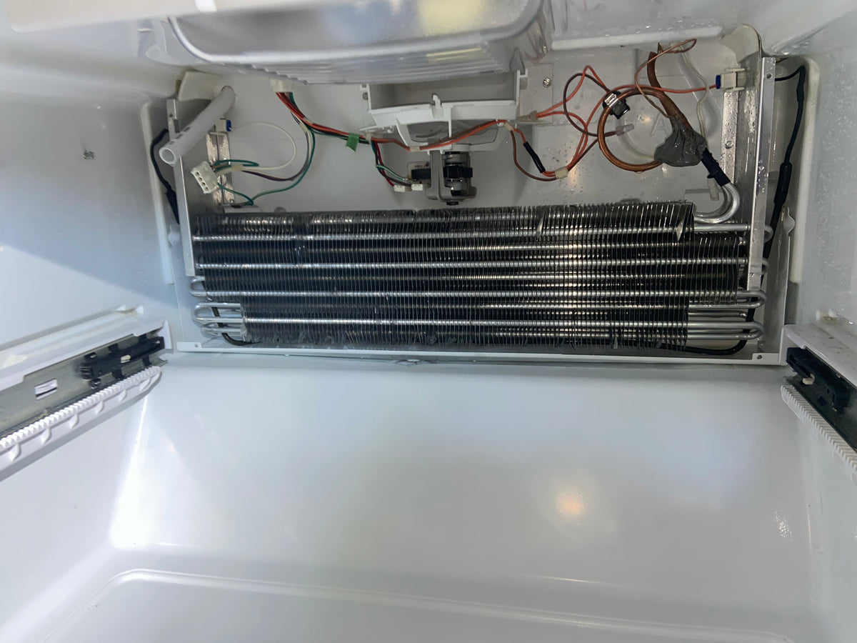 Refrigerator repair in progress by T&B Appliance Repair in Medford Oregon